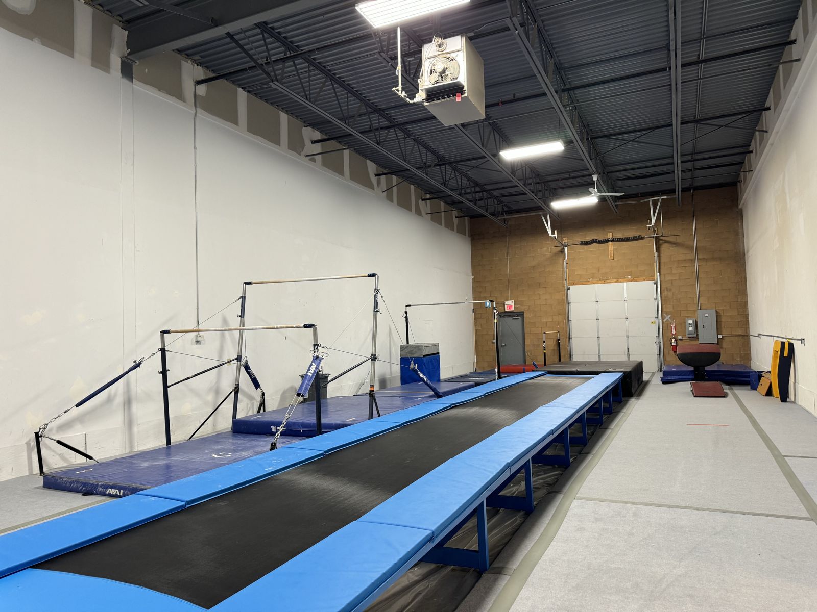 Bars and the tumble track in the main gym